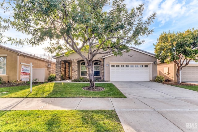 ranch-style house with a garage and a front yard