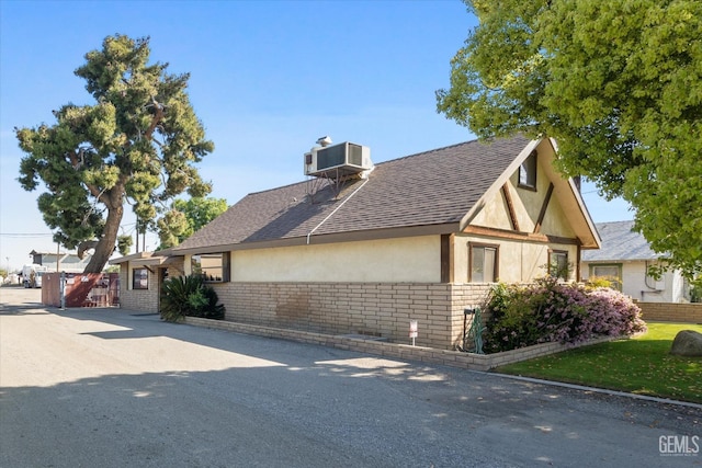 view of home's exterior with cooling unit