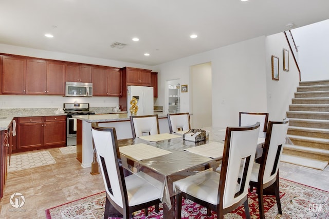 7327 Glitter Way, Bakersfield, CA 93313 - dining area featuring recessed lighting and stairway