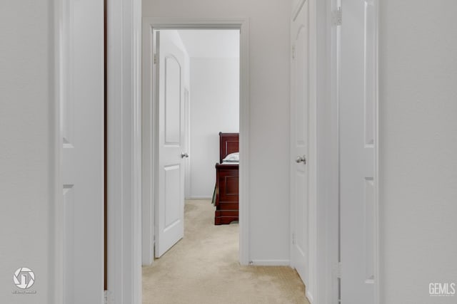 7327 Glitter Way, Bakersfield, CA 93313 - corridor featuring light colored carpet and baseboards