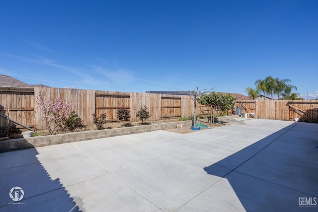 7327 Glitter Way, Bakersfield, CA 93313 - fenced backyard with a patio