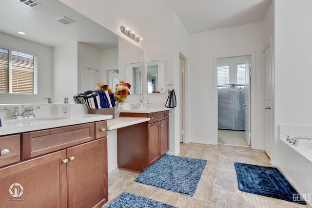 7327 Glitter Way, Bakersfield, CA 93313 - full bathroom featuring vanity, a garden tub, and a closet