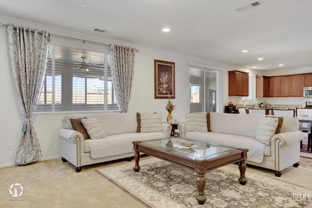 7327 Glitter Way, Bakersfield, CA 93313 - living room featuring light colored carpet and recessed lighting