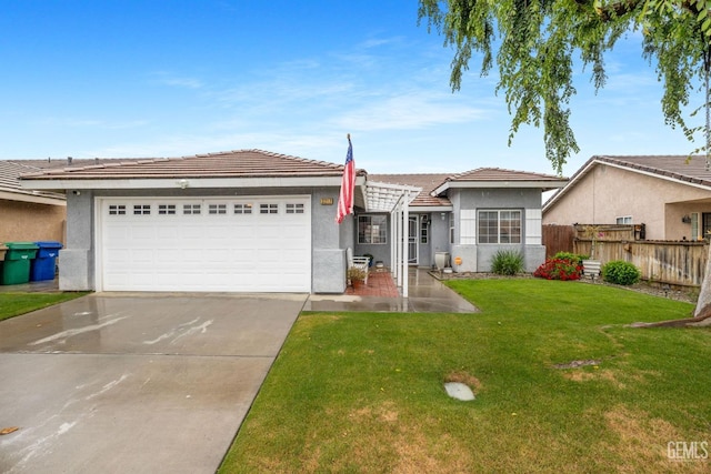 ranch-style house featuring an attached garage, fence, stucco siding, and concrete driveway