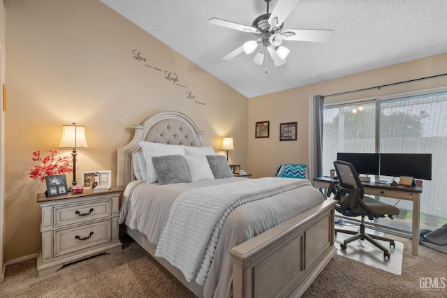 carpeted bedroom with a ceiling fan, vaulted ceiling, and a textured ceiling