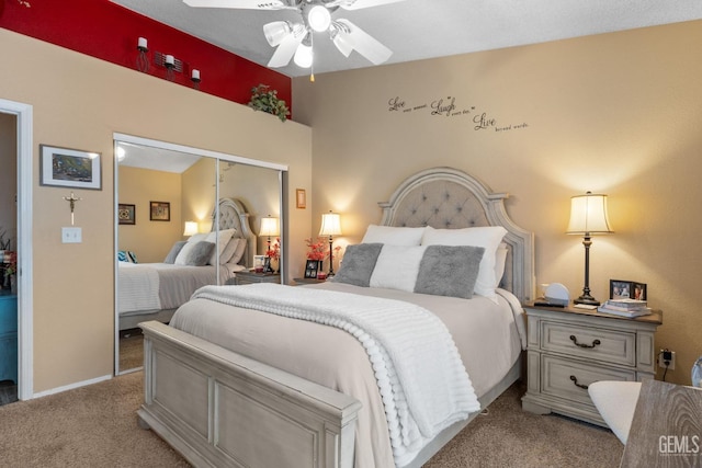 carpeted bedroom with baseboards, ceiling fan, and a closet