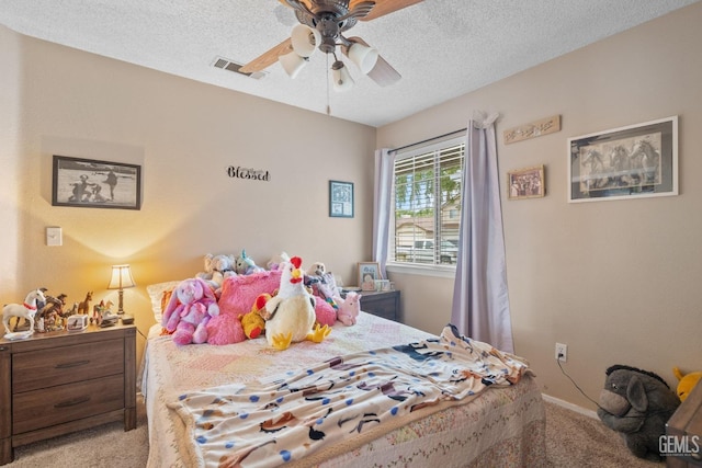 bedroom featuring carpet flooring, ceiling fan, a textured ceiling, baseboards, and visible vents