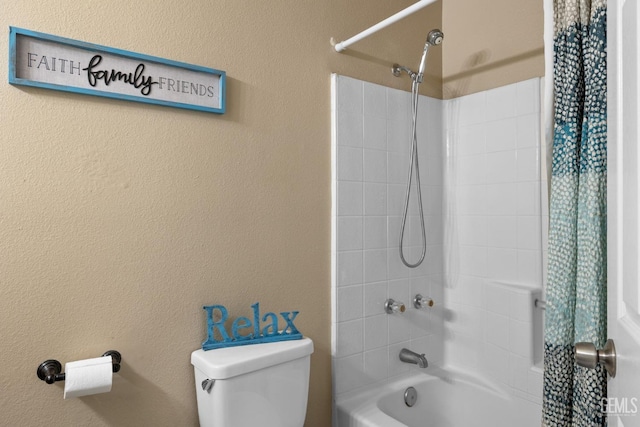 bathroom featuring toilet and shower / tub combo with curtain