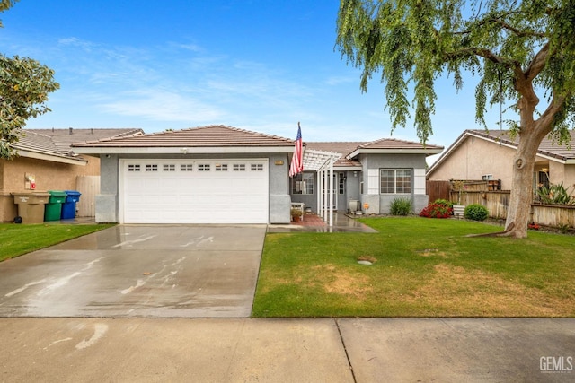 ranch-style house featuring a garage, stucco siding, a front yard, and concrete driveway