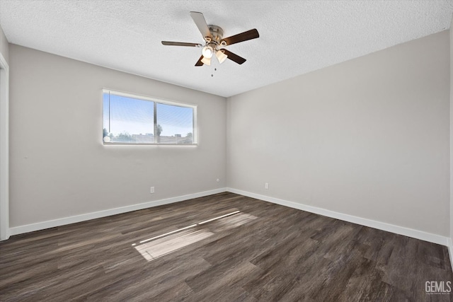 unfurnished room with ceiling fan, dark hardwood / wood-style floors, and a textured ceiling