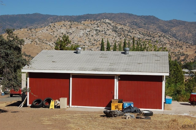 view of outbuilding with a mountain view