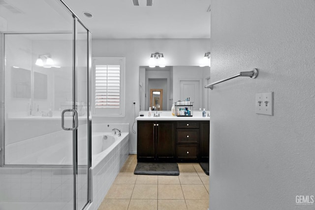 bathroom with tile patterned flooring, a garden tub, vanity, and a shower stall