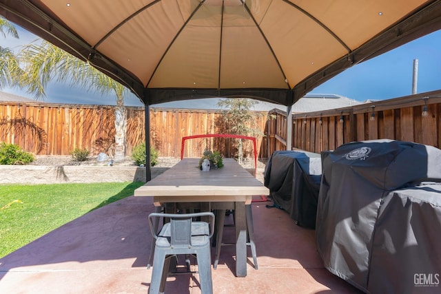 view of patio / terrace with outdoor dining space, a gazebo, fence, and a grill