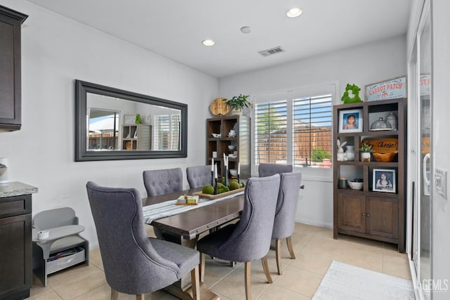 dining room featuring light tile patterned floors, visible vents, baseboards, and recessed lighting