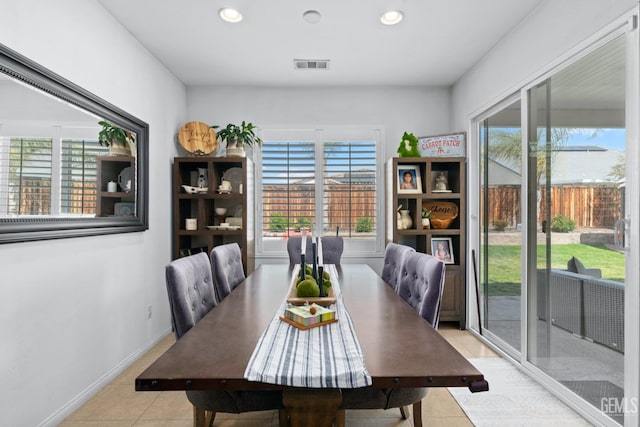 tiled dining space featuring a wealth of natural light, visible vents, and recessed lighting