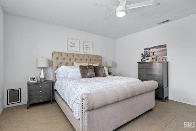 bedroom featuring tile patterned floors, visible vents, baseboards, and a ceiling fan