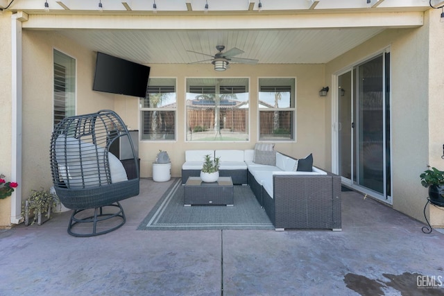 view of patio featuring a ceiling fan and outdoor lounge area