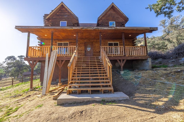 back of house with a wooden deck