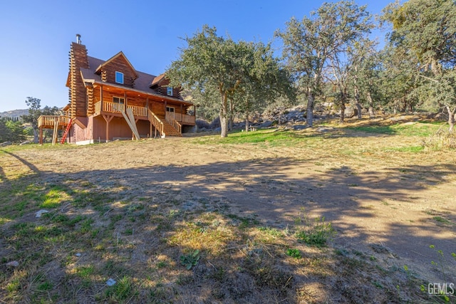 view of yard featuring a wooden deck