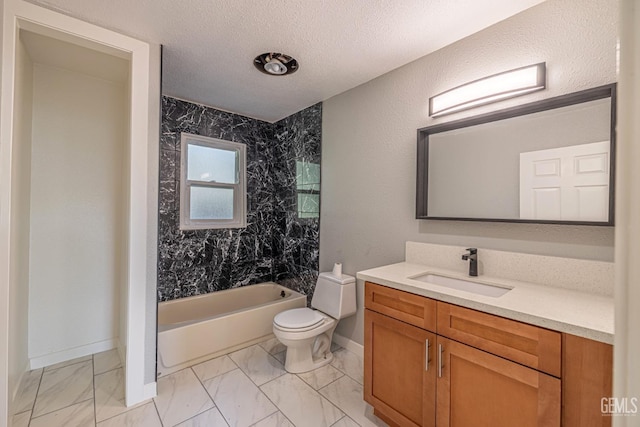 full bathroom featuring a textured ceiling, vanity, toilet, and tiled shower / bath