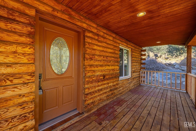 view of exterior entry featuring a porch