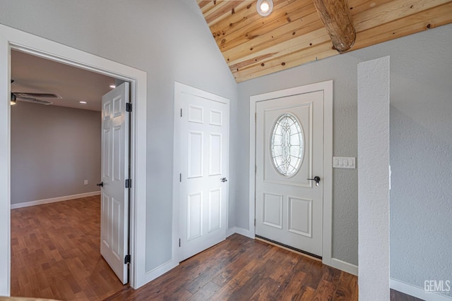 entryway featuring vaulted ceiling with beams, ceiling fan, dark wood-type flooring, and wood ceiling