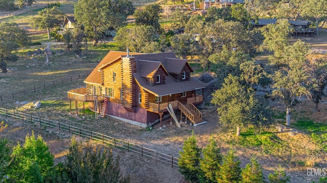 birds eye view of property featuring a rural view