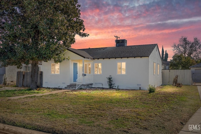 view of front of home with a lawn