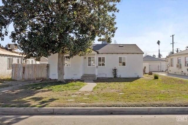 bungalow-style home featuring a front yard