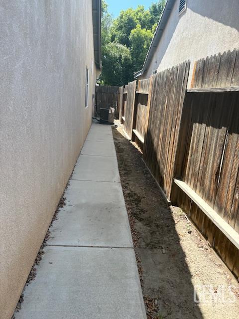 12006 Roaring River Ave, Bakersfield, CA 93311 - view of side of home with stucco siding