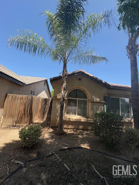 12006 Roaring River Ave, Bakersfield, CA 93311 - view of front of home featuring stucco siding and a tiled roof