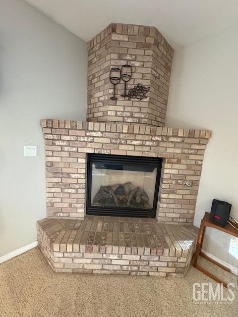 12006 Roaring River Ave, Bakersfield, CA 93311 - detailed view of carpet flooring and a brick fireplace