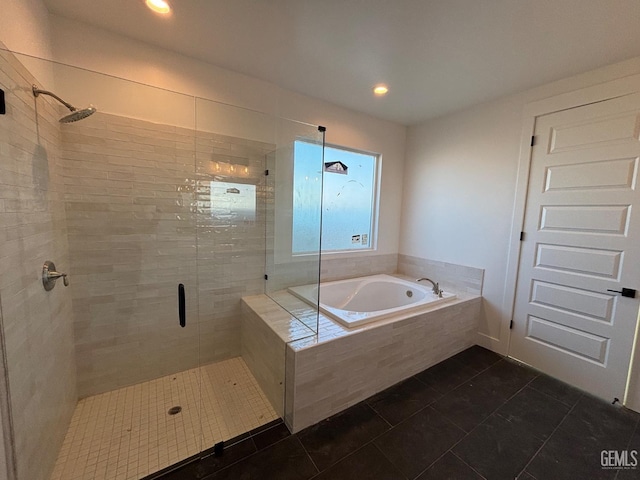 bathroom with a stall shower, recessed lighting, a garden tub, and tile patterned floors