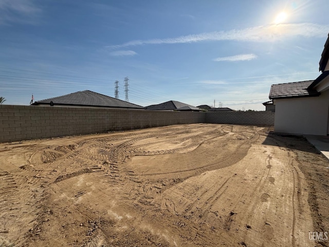 view of yard with a fenced backyard