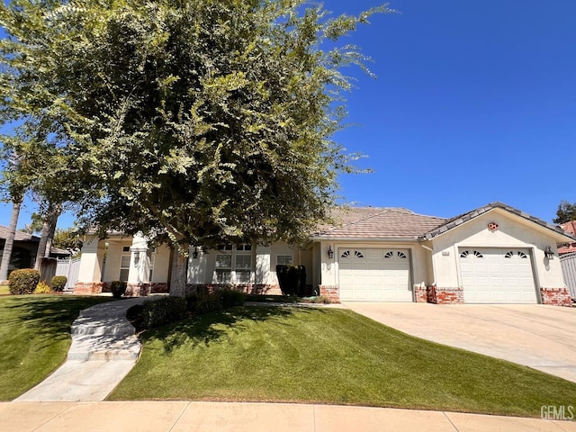 4812 Prairie Meadows Way, Bakersfield, CA 93312 - view of front of house featuring a garage, driveway, a front yard, and a tile roof