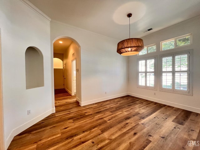 4812 Prairie Meadows Way, Bakersfield, CA 93312 - spare room with ornamental molding, wood finished floors, and arched walkways