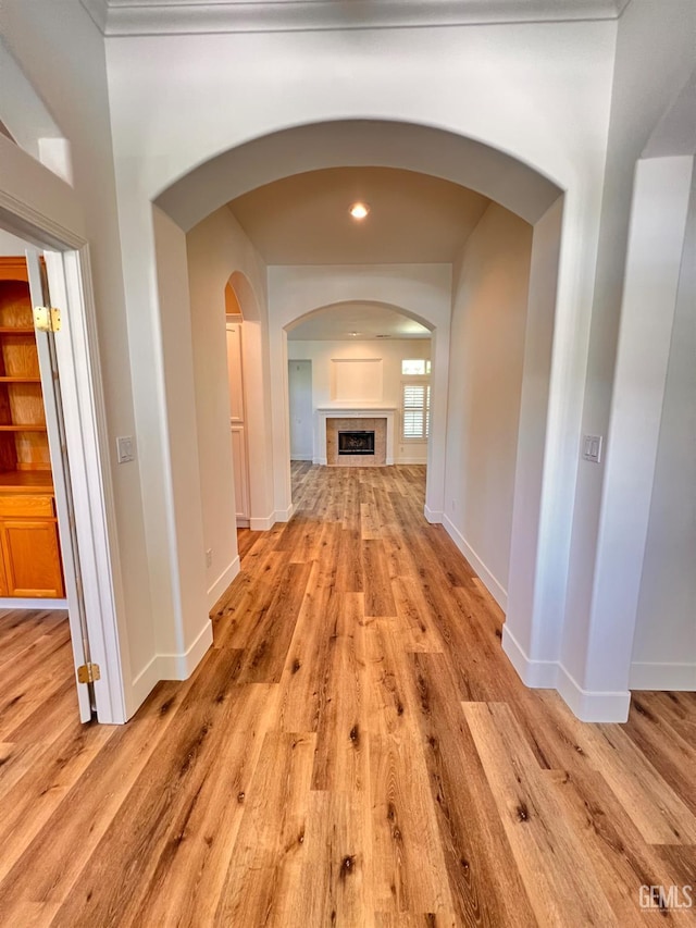 4812 Prairie Meadows Way, Bakersfield, CA 93312 - corridor with light wood-type flooring, arched walkways, and recessed lighting