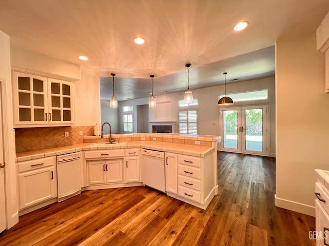 4812 Prairie Meadows Way, Bakersfield, CA 93312 - kitchen featuring dishwasher, a peninsula, recessed lighting, dark wood finished floors, and white cabinets