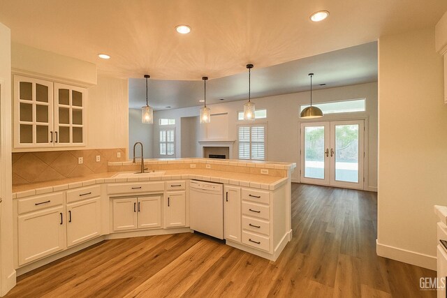 4812 Prairie Meadows Way, Bakersfield, CA 93312 - kitchen featuring white dishwasher, light wood finished floors, a peninsula, french doors, and recessed lighting
