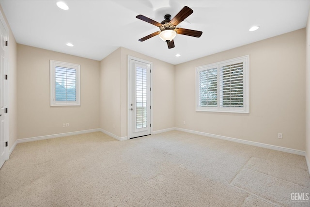 unfurnished room featuring light carpet and a healthy amount of sunlight