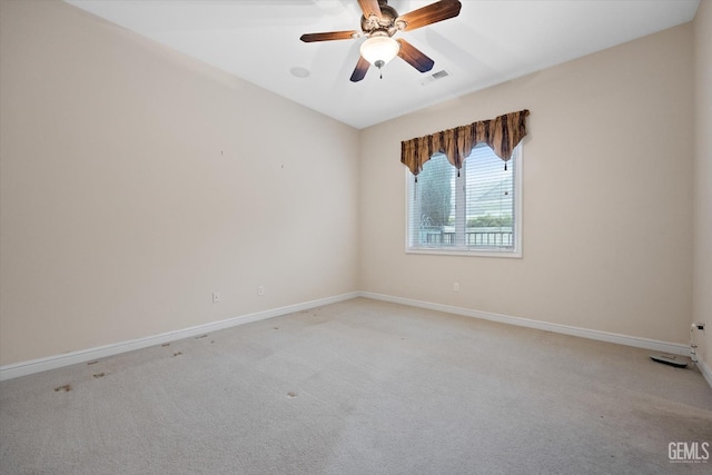 unfurnished room featuring ceiling fan and light colored carpet