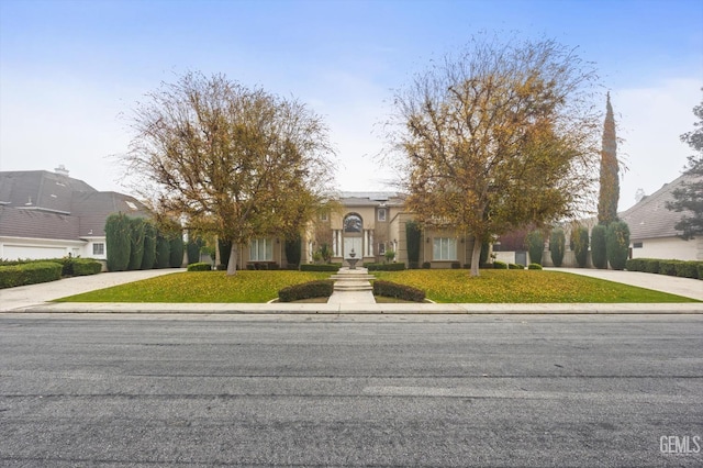 view of front of home with a front lawn