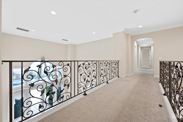 corridor with light carpet and ornamental molding