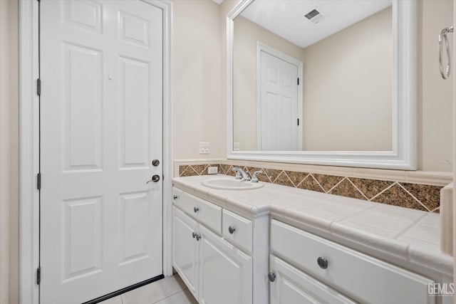 bathroom with tile patterned floors and vanity