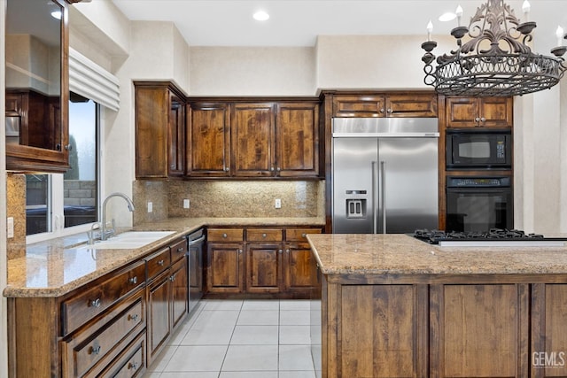 kitchen with black appliances, sink, decorative backsplash, light stone countertops, and light tile patterned floors