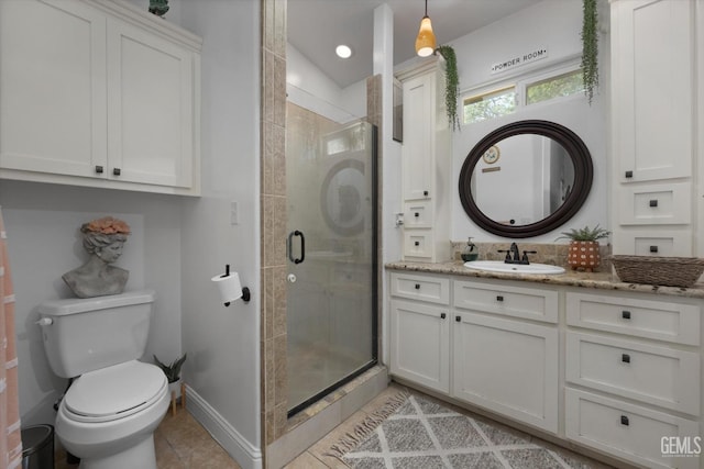 bathroom with tile patterned floors, toilet, vanity, and walk in shower