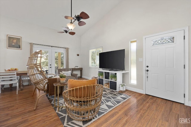 living room featuring ceiling fan, french doors, high vaulted ceiling, and wood-type flooring