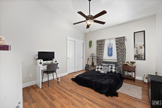 bedroom with hardwood / wood-style floors and ceiling fan