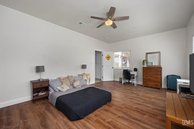 bedroom with ceiling fan and dark wood-type flooring