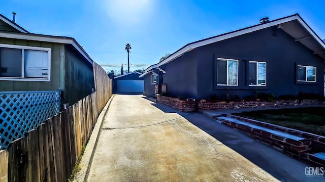 view of side of property with a garage